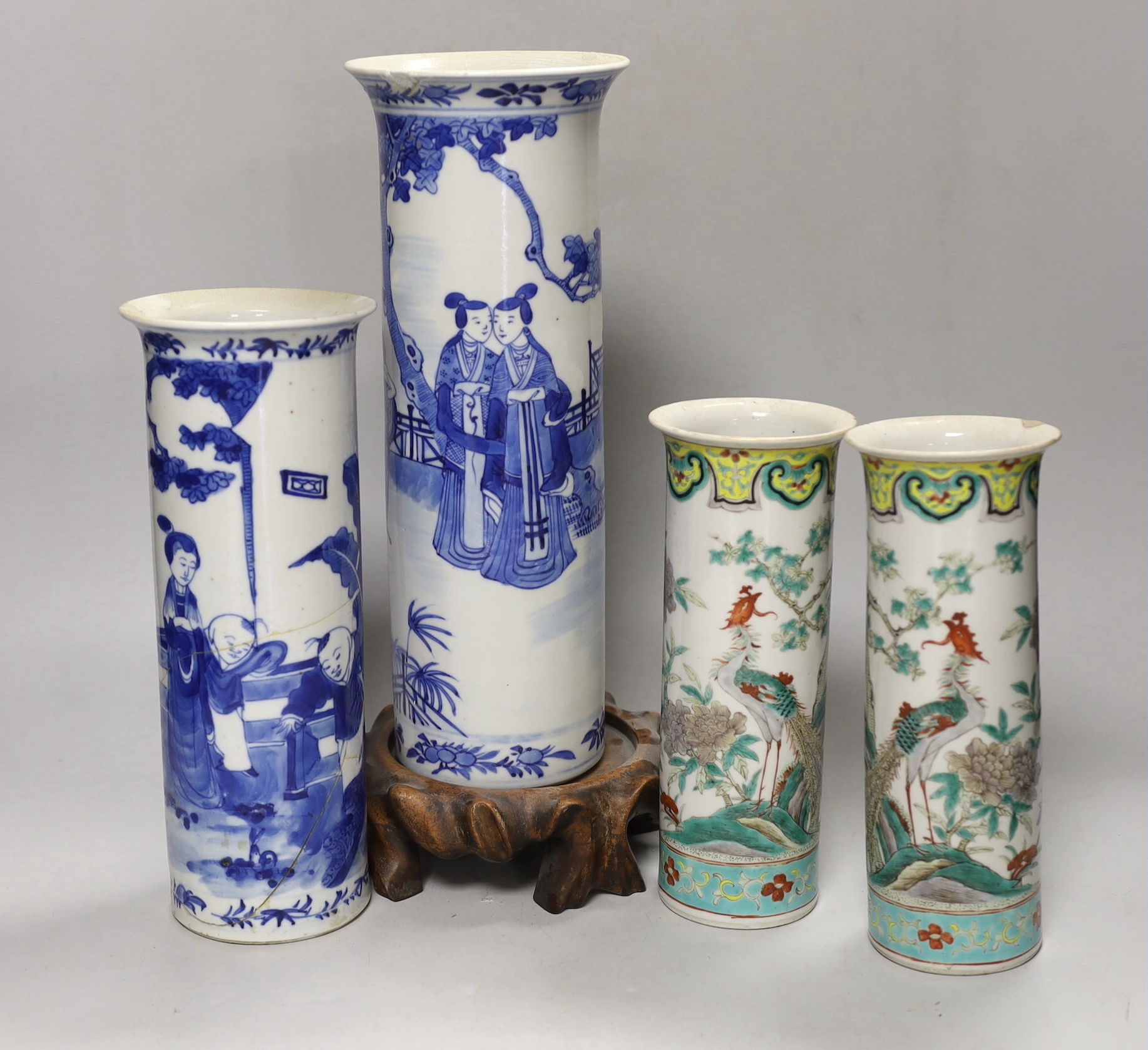Two 19th century Chinese blue and white cylinder vases, one on stand and a pair of famille verte cylinder vases, tallest 30cm high
